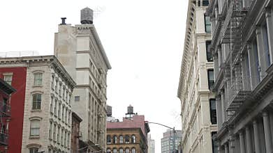 New York City building architecture. Residential house exterior. USA real estate. Rooftop water tower
