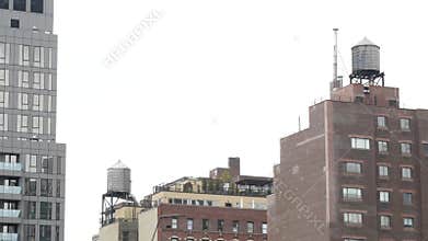 New York City building architecture. Residential house exterior. USA real estate. Rooftop water tower