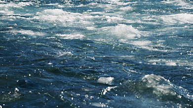 The Dynamic River Water Surface is adorned with Swirling Waves and intriguing Bubbles that mesmerize viewers