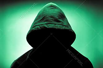Hooded man with face in shadow