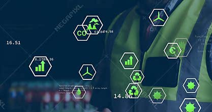 Male technician tapping tablet in industrial control hub analyzing floating hexagon CO? chart icons