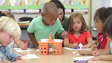 Group Of Elementary Age Children In Art Class