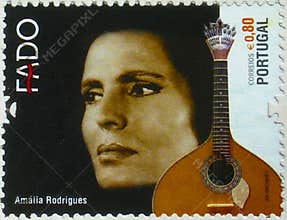 Portuguese Fado stamp: Amália Rodrigues and a traditional Portuguese guitar.
