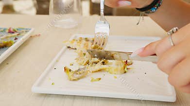 Woman Cutting And Eating Fresh Swordfish