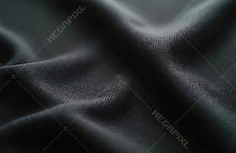 Close-up of black sportswear fabric with subtle texture. Durable polyester material offers smooth, elegant surface, perfect for