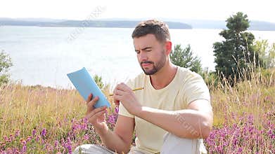 Author writing around inspiring nature