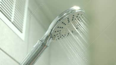 Running water shower head in modern bathroom