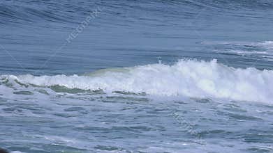 Two nicely formed waves breaking one after the other.