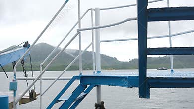 View from Ferry Deck with Coastal Mountains and Distant Boat