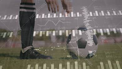 Female soccer player crouching picking up ball while bar charts rising for sports analytics metrics