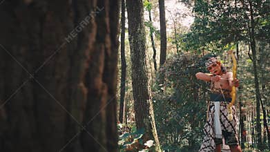 Javanese Archer Aiming Bow from Behind a Tree