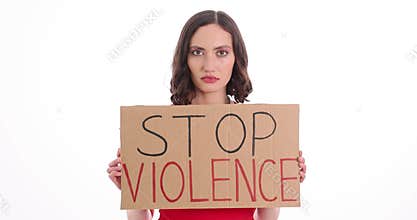 Young woman shows Stop Violence placard on white background