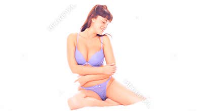 brunette woman on white bed