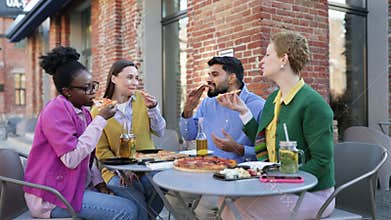 Friends Sharing Pizza Outdoors