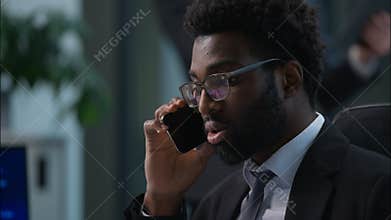 Two multiethnic coworkers businessmen African American Caucasian business men males guys managers employers colleagues