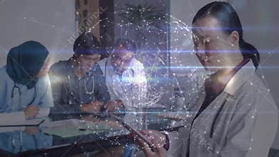 Female physician swiping tablet and syncing patient data with holographic globe for medical review