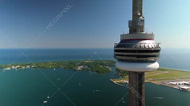 A breathtaking Aerial View showcasing the Iconic CN Tower alongside the stunning Toronto Waterfront area