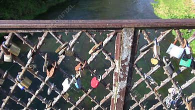 Lovers locks on river bridge rail