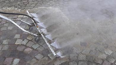 Professional cleaning cobblestone pavement