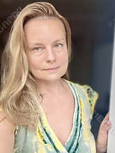 portrait of a blonde woman in her 50s