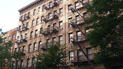 New York City building architecture. Residential house exterior. USA real estate. Fire escape ladder