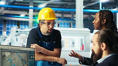 Photovoltaics factory team leader gives workers tasks after troubleshooting