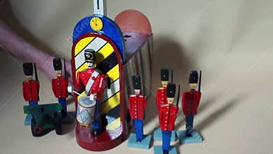 drummer is drumming next to the brave guards with a cannon