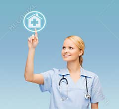 Smiling doctor or nurse pointing to hospital icon