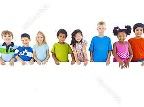 Group of Children Standing Behind Banner
