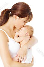 Mother kissing newborn baby holding in hand, white
