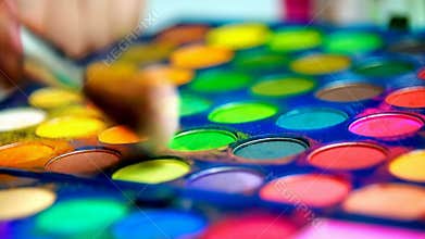 Close,up colorful eyeshadow makeup palette vibrant cosmetic beauty shades art stock footage Generative AI