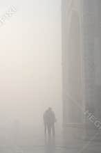 Silhouette of loving couple in a haze ,near Taj Mahal,India