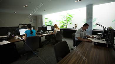 Time lapse of busy city office workers working in office