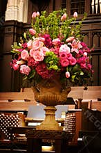 Large vase of Wedding flowers in a church