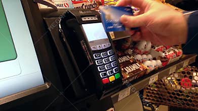 Close up man paying food by credit card