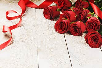 Bouquet of red roses on grunge background