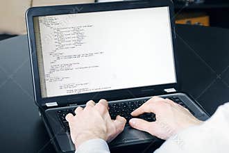 Website development process - programmer writing code