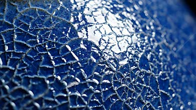 Macro closeup view of blue ceramic surface developing fine crackle glaze under bright light reflection. AI-Generated.