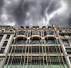 Cloudy skies above a building in Paris during an overcast day in the city with urban architecture