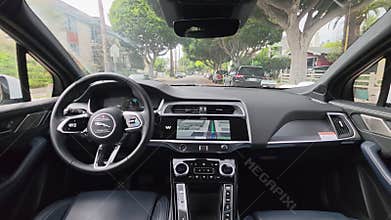 California, USA - Mar 25, 2026: interior view of autonomous Jaguar vehicle with Waymo screen, steering wheel logo and