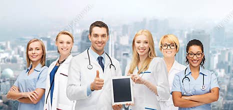 Team or group of doctors with tablet pc computer