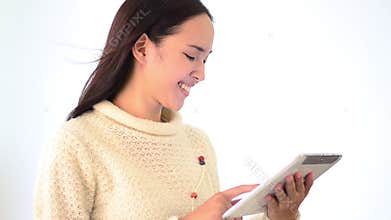 Asian woman smile face emotion and touching computer tablet
