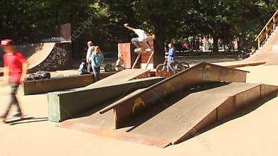 Teens practicing skateboard