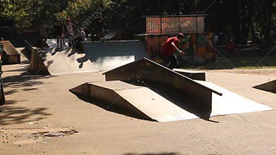 Teens practicing skateboard