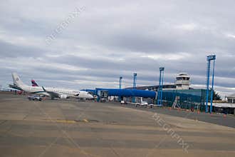 Latam Airlines Airbus A321 and Amelia Embraer E190LR in Silversea Expeditions livery at the terminal gates in Punta Arenas airport