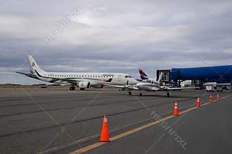 Latam Airlines Airbus A321 and Amelia Embraer E190LR in Silversea Expeditions livery at the terminal gates in Punta Arenas airport