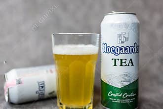 Bangkok, Thailand - June 04, 2026 : Glass of Hoegaarden TEA placed togeter with an aluminium tin Hoegaarden TEA, 500ml