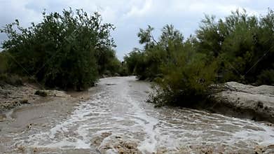 Flood Water Rushing Down a Desert Wash After a Heavy Monsoon in Phoenix, Arizona USA