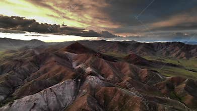 Patagonia Argentina mountains at sunset reveal rugged ridges, deep valleys, dramatic skies, rocky summits, southern ranges