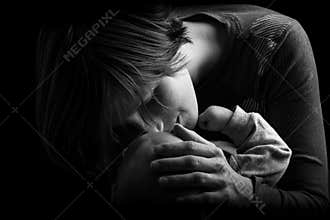 Mother Tenderly Nuzzling Baby